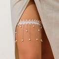 Macro shot of white lace leg garter with silver metal chains and pearl accents - White Pearl Tassel Style (0366)