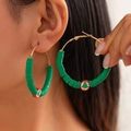 Detailed view of Christmas hoop earrings with green heishi beads and festive tree charm - Green Christmas Tree Style (3423-K3)