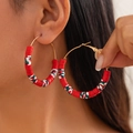 Detail of bohemian red green and white clay bead hoop earrings with gold leverback closure - Striped Multicolor Hoop (3423-K4)