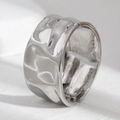 Macro detail of silver-toned wide cuff bracelet with irregular hammered texture finish - Wide Irregular Texture Hinged Style (2550)