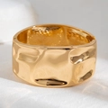 Macro detail of golden wide cuff bracelet with irregular hammered texture and hinge - Wide Irregular Hammered Hinged Style (2550)