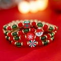 Macro shot of Christmas beaded bracelets with Santa Claus and snowflake pendants - Multicolor Set 03 (5601)