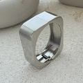 Detailed macro view of polished silver square bangle with spring hinge on stone surface - Bangle / Silver Plated Style (2635)
