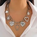 Detail shot of multi-heart pendant necklace with striped metal chain links for women - Heart Multi-Pendant Necklace / Silver (6865)