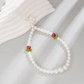 Acrylic pearl phone strap with red tulip beads and a white bow knot on wave decor - White + Red