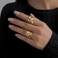 Minimalist gold-plated irregular ring set with textured lava design on model fingers - Light Gold Liquid Flow Style