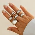 Silver thick irregular curved rings set with polished metallic finish on model's hand - 02 Silver Plated Ring Set (5524)