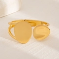Minimalist gold asymmetric teardrop spring bracelet displayed on a white stone base - 01 Gold Bangle (2676) / Gold