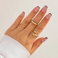 Close-up of golden teardrop ring and chunky band set styled on hand with white shirt - Light Gold Style (5654)