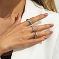 Macro detail of three-piece silver ring set including smooth band and water drop design - Silver Style (6965)