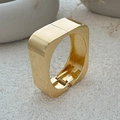 Close-up of a polished gold square hinged bangle on a minimalist stone surface - Bangle / Gold Style (2635)