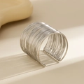 Detail of wide multi-strand silver metal cuff bracelet with elegant shadow texture - Multi-layer Wire Wrap (2212) / Silver