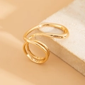 Macro detail of gold layered wavy ring on stone showcasing polished minimalist textures - Light Gold Irregular Wave Double Layer Ring (0824)