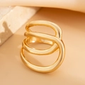 Macro detail of gold multilayer ring with polished organic curves on stone texture - Light Gold Multi-layer Irregular Ring (0822)