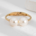 Detail view of gold-plated multi-layer pearl bracelet with a flexible hinge closure - 01 Double Large Pearl Open Bangle (2773) / Gold