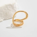 Detailed macro shot of an irregular 18K gold-plated cuff with polished fluid metal design - Wrapped Geometric Shape (0824) / Light Gold Ring