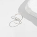 Detailed view of polished silver double-ring sculptural design with high-gloss finish - 05 Silver Crossover Double Ring (0823)