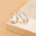 Detailed view of silver asymmetric layered bangle with high-polished mirror finish - Wrapped Geometric Shape (0824) / Silver Ring