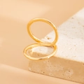 Detail shot of golden minimalist double-loop geometric ring on a textured stone base - 05 Light Gold Ring (0823)