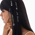 Detail of silver hair charms with colorful stones and butterfly pendants on black braids - Alloy And Crushed Stone / Star Moon Butterfly Style (5790)