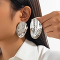 Silver metallic irregular oval earrings with glossy wrinkled texture on female model - Irregular Wave Oval (3497) / Silver (3497)