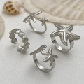 Set of four silver starfish rings and conch textured bands for beach vacation style - Ring Set / Silver