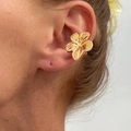 Close-up of golden petal-shaped ear cuff with textured finish on a model's ear - Flower Shape / Gold (1PC)