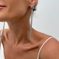 Macro detail of silver tassel earrings with woven metal ball stud on a model - Silver Earrings (3568)