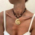 Golden nautilus pendant necklace with leopard print fabric cord shown on a model - Conch Style (7101)