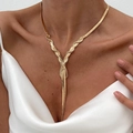 Golden woven herringbone chain necklace in a Y-shaped design on a female model - Gold (7087)