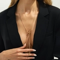 Golden snake chain Y-necklace with metallic bead drop pendant on a fashion model - Gold Style 6 (7493)