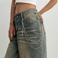 Detail view of multi-layer silver pants chain with cross pendant on denim jeans - Multi Layer Cross Style (1776)