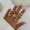 Set of 7 gold-toned ocean-themed stackable rings with starfish and shell designs - Light Gold Starfish Knuckle Ring Style