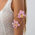 Bohemian gold upper arm cuff featuring realistic pink orchid flowers on a model - 03 Gold+Pink Arm Cuff (0398K1)