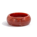 Detailed view of wide resin bangle with red and white marbled texture and polished finish - Burgundy