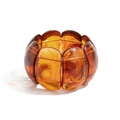 Detail of amber resin stretch bracelet showing tortoise shell texture and curved segments - Resin Slices (2958) / Amber
