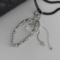 Detail showing heart charm with black curb chain and faux pearl accents on a bag charm - Silver Style