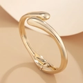 Golden irregular spring bangle with minimalist cross water drop design and polished finish - Gold Bracelet (2426k1)