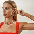Detailed view of Christmas jewelry set with festive tree and snowman charms on a model - Gold Set (6778)