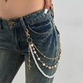 Detail of layered gold pant chain with white pearls and colorful flower pendants - Gold 1966