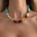 Detail of colorful resin beads and large gold-toned irregular metallic beads on a necklace - Gold (07771)