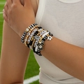 Close-up of football themed multi-layer beaded bracelet set with soccer jersey charm - Black White Gold Soccer Theme (6994)