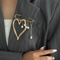 Lava heart brooch with white pearls and gold tassel on a dark striped blazer - Gold 0311
