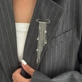 Silver star tassel chain brooch shown pinned to a grey striped suit lapel - Star Tassel Style (0318) / Silver (0318)