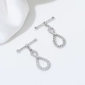 Macro detail of 14K gold filled infinity figure-eight OT toggle clasp with pavé zircons - Style A / White Gold