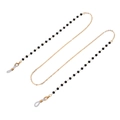Detail of beaded glasses chain with gold lobster clasps and black beads on white background - Black Gold