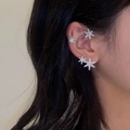 Silver snowflake ear cuff set with white zircons shown on model in a side view - Snow Crystal Silver Right