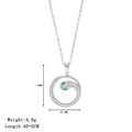 Zilveren slangenketting met fonkelende kristallen en groene edelsteenogen aan de hanger - Platina