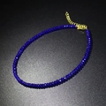 Detail view of dark blue faceted crystal beads choker with golden lobster clasp and chain - Blue