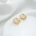 Close-up of polished 14K gold-plated teardrop hoop earrings on white silk fabric - 1# 14K 17x18x6mm